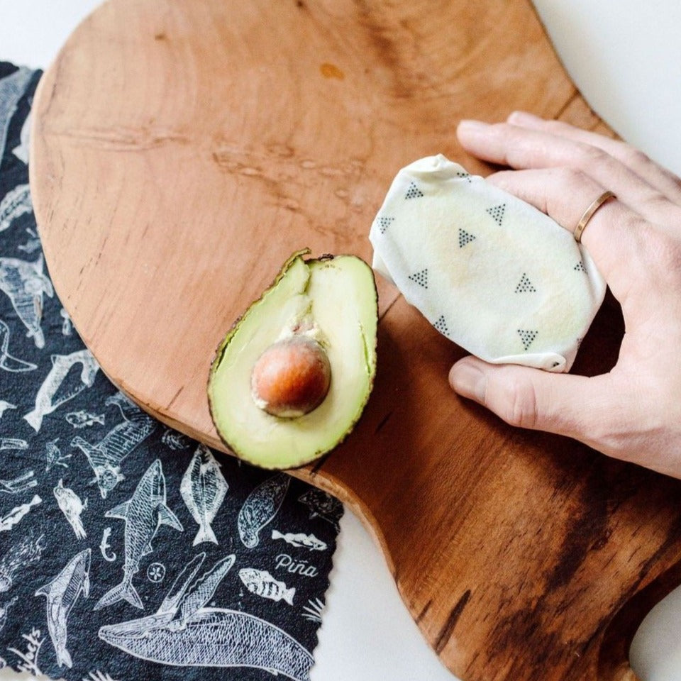 avocado wrapped with a goldilocks beeswax wrap from species of ucluelet print