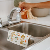reusable dish cloth in sink with floral design