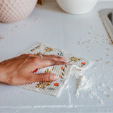 wiping up a mess on the counter with swedish dish cloth