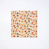 a medium beeswax food wrap featuring brightly coloured mushrooms of all different shapes, colours and sizes